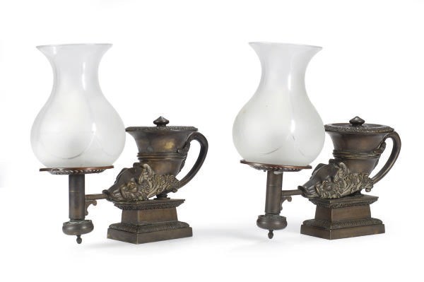 A PAIR OF VICTORIAN PATINATED BRONZE AND GLASS FLUID LAMPS,