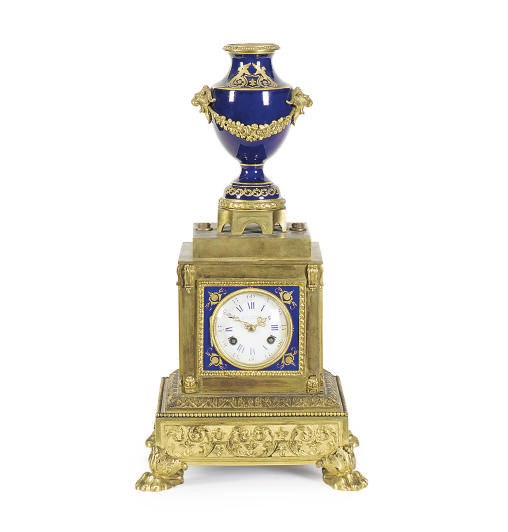 A FRENCH PORCELAIN AND GILT-BRONZE MANTELCLOCK,
