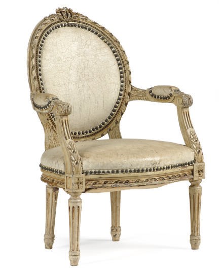 A FRENCH CREAM-PAINTED AND LEATHER UPHOLSTERED CHILD'S CHAIR,