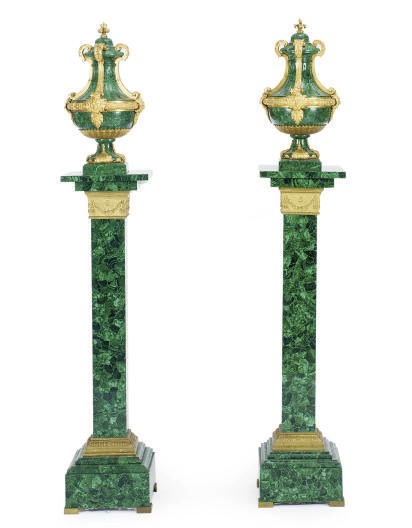 A PAIR OF GILT-BRONZE MOUNTED MALACHITE COVERED URNS-ON-PEDESTALS,
