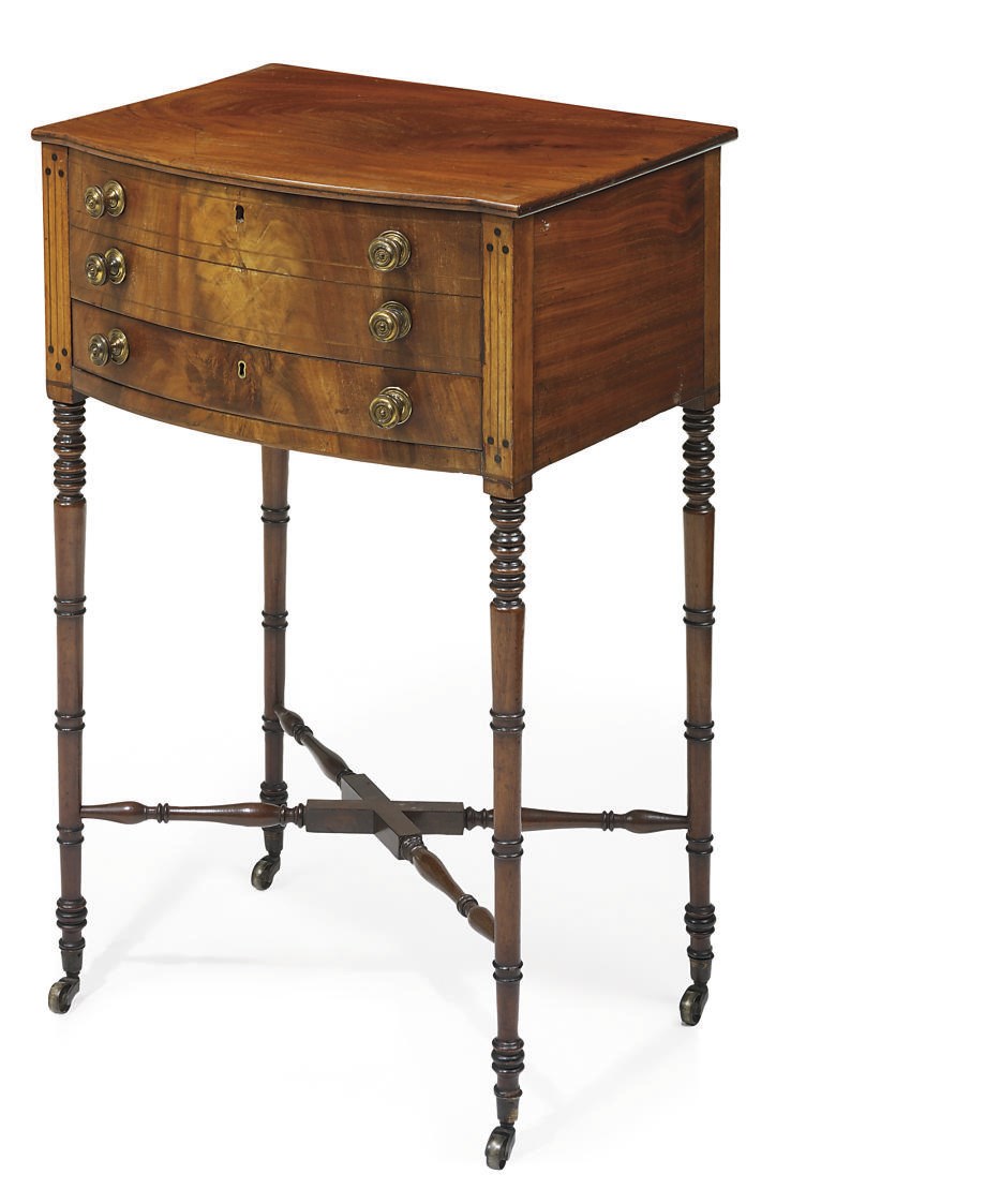 AN EARLY VICTORIAN MAHOGANY AND EBONISED BOWED WORK TABLE