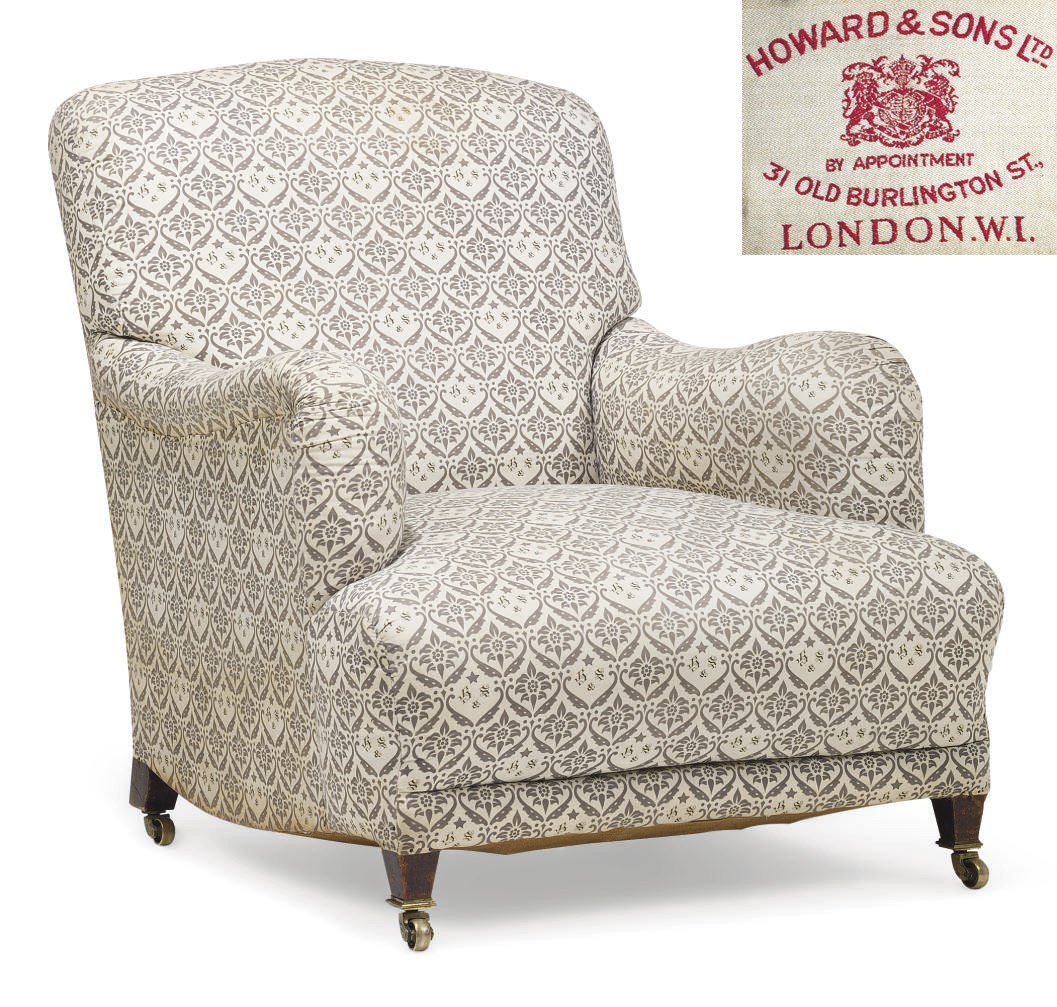 AN EDWARDIAN MAHOGANY EASY ARMCHAIR