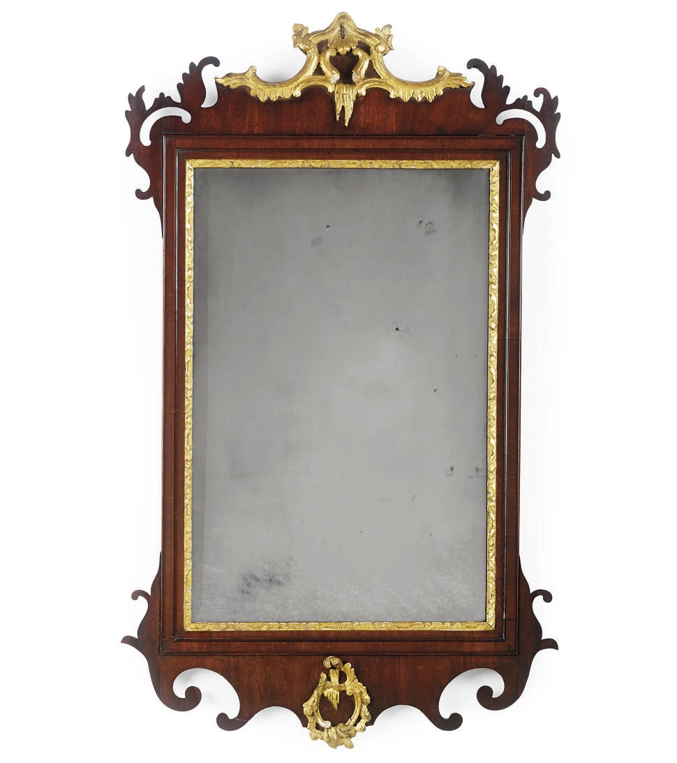 A VICTORIAN MAHOGANY AND PARCEL-GILT MIRROR