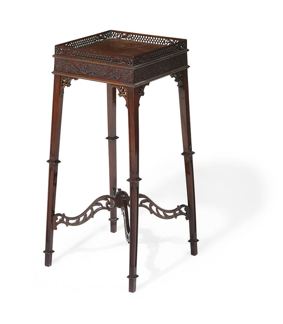 AN EDWARDIAN MAHOGANY URN STAND