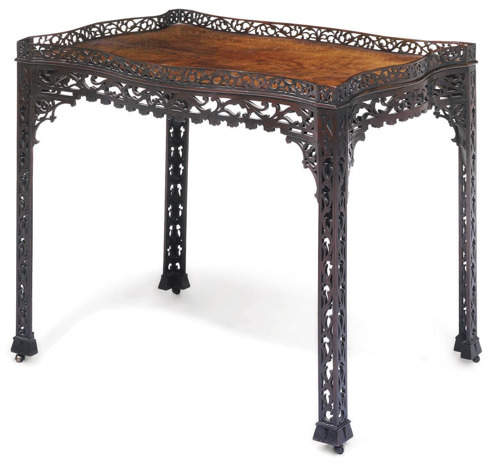 A LATE VICTORIAN MAHOGANY SERPENTINE SILVER TABLE