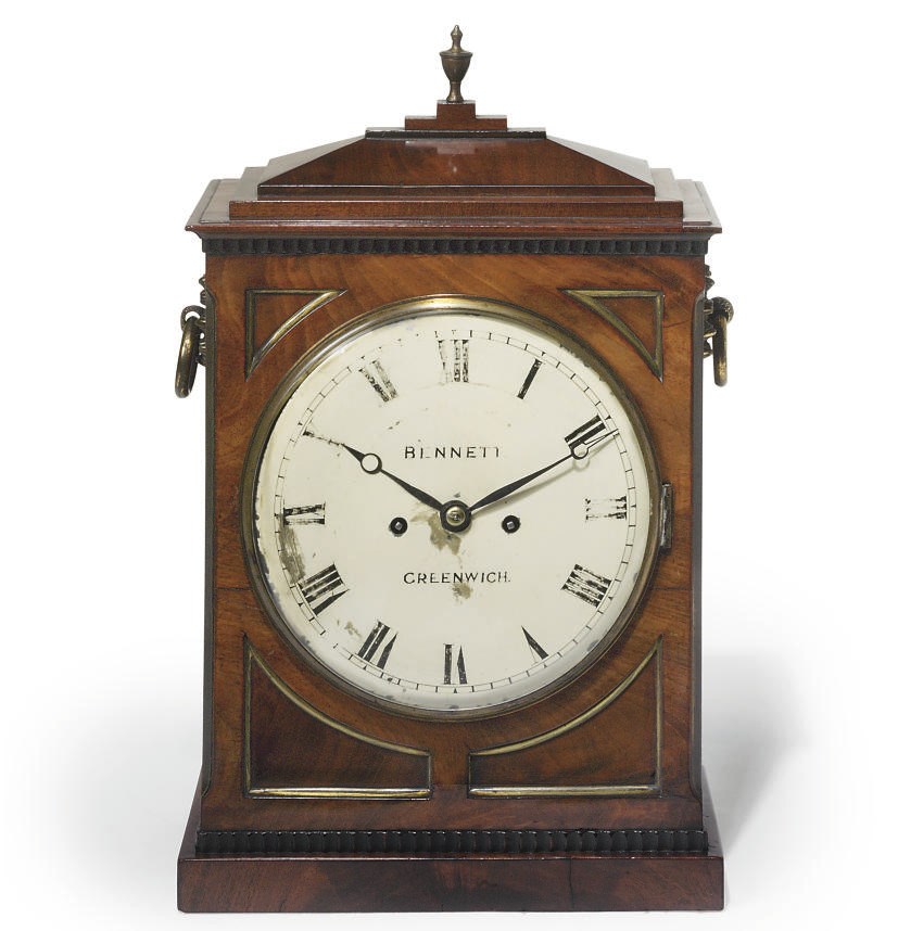 A George IV brass-mounted mahogany striking eight day table clock