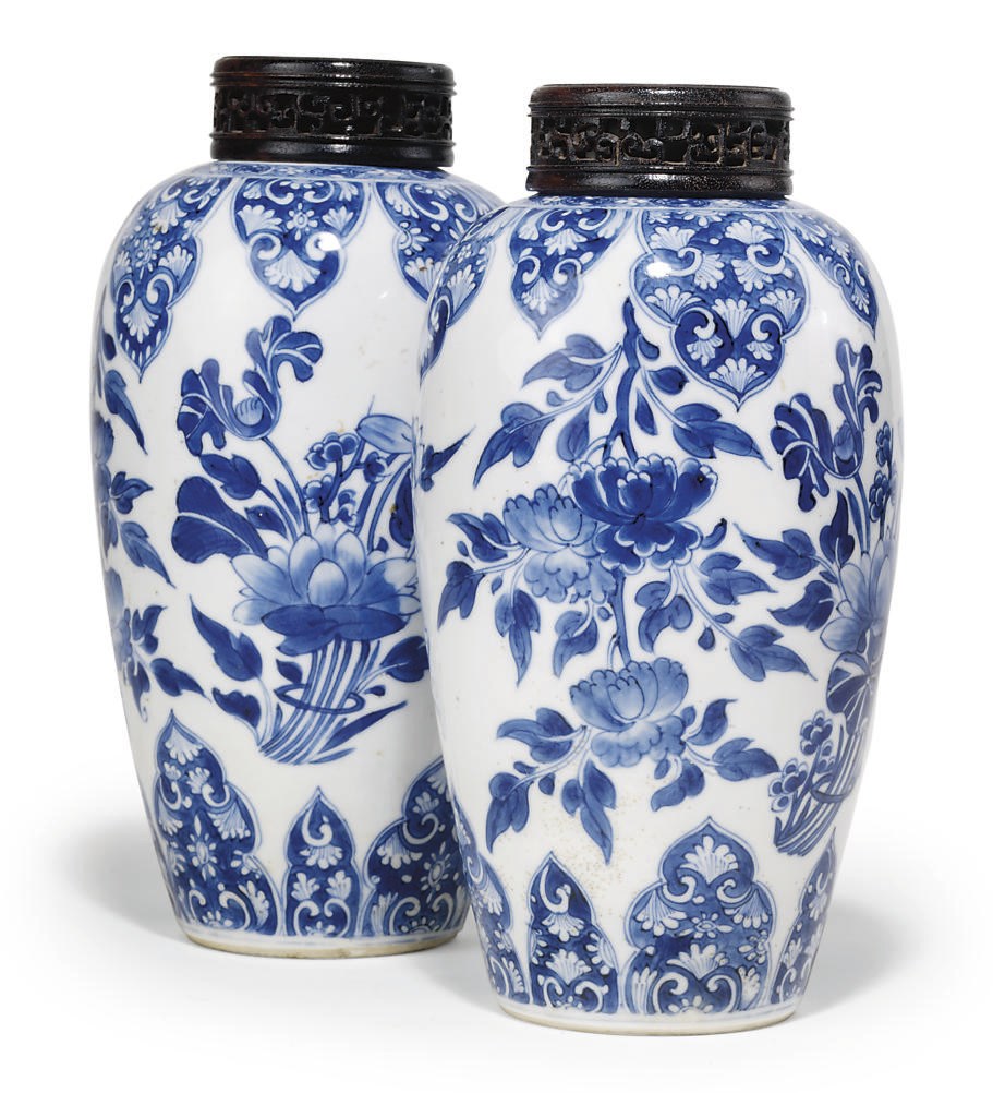 A PAIR OF CHINESE BLUE AND WHITE OVOID JARS AND WOOD COVERS