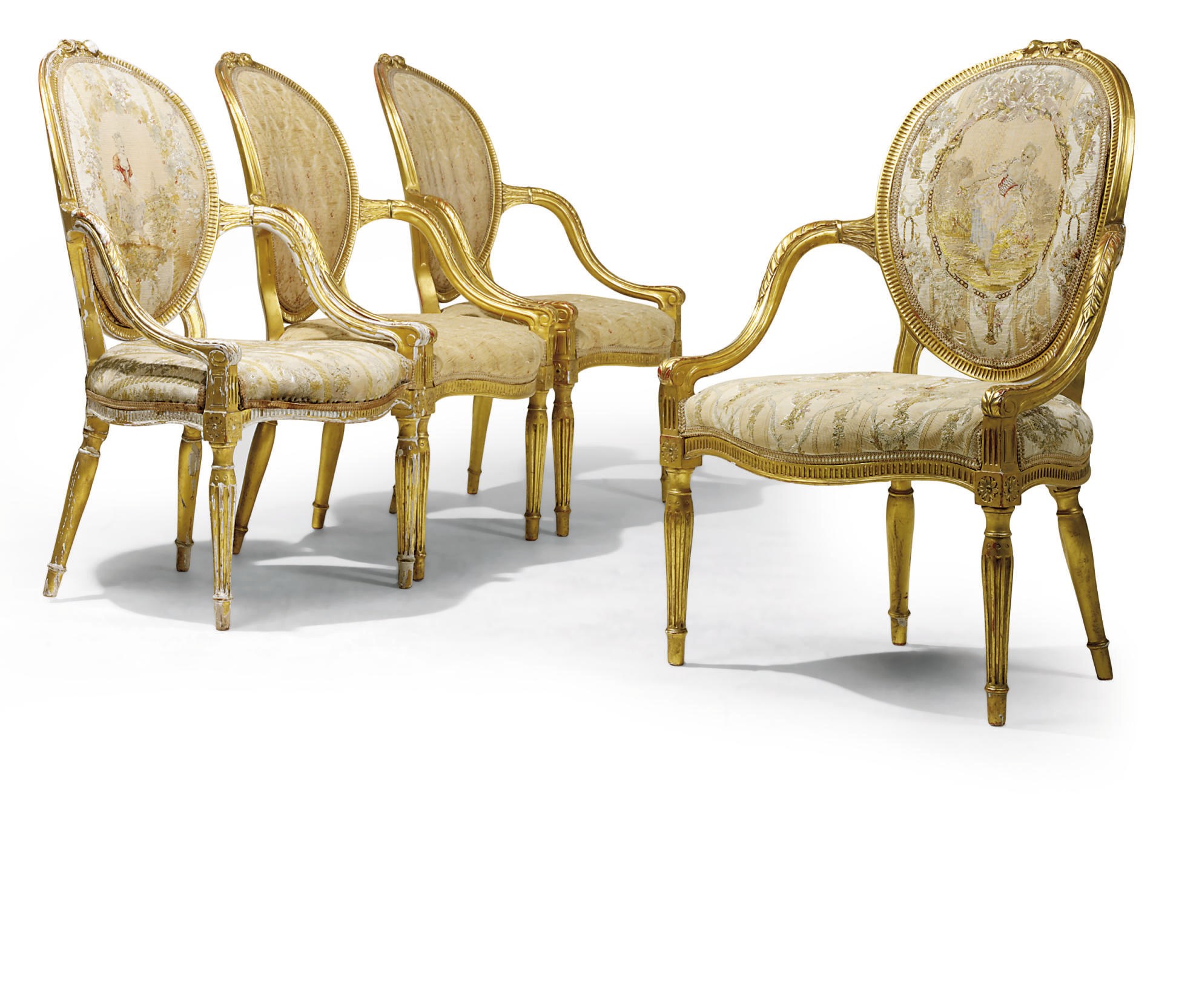 A SET OF FOUR GEORGE III GILTWOOD ARMCHAIRS