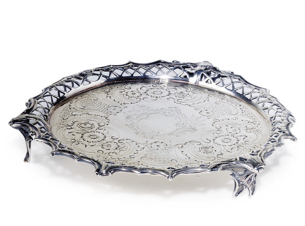 A SMALL GEORGE III SILVER SALVER WITH CAST BORDER