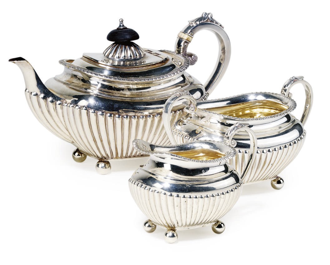A LATE VICTORIAN SILVER THREE-PIECE BACHELOR'S TEA SET