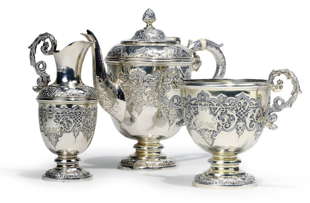 A LATE VICTORIAN PARCEL-GILT SILVER THREE-PIECE BACHELOR'S TEA SET