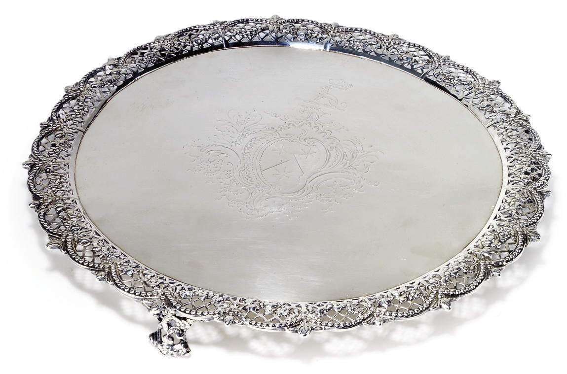 A GEORGE III SILVER SALVER WITH CAST BORDER