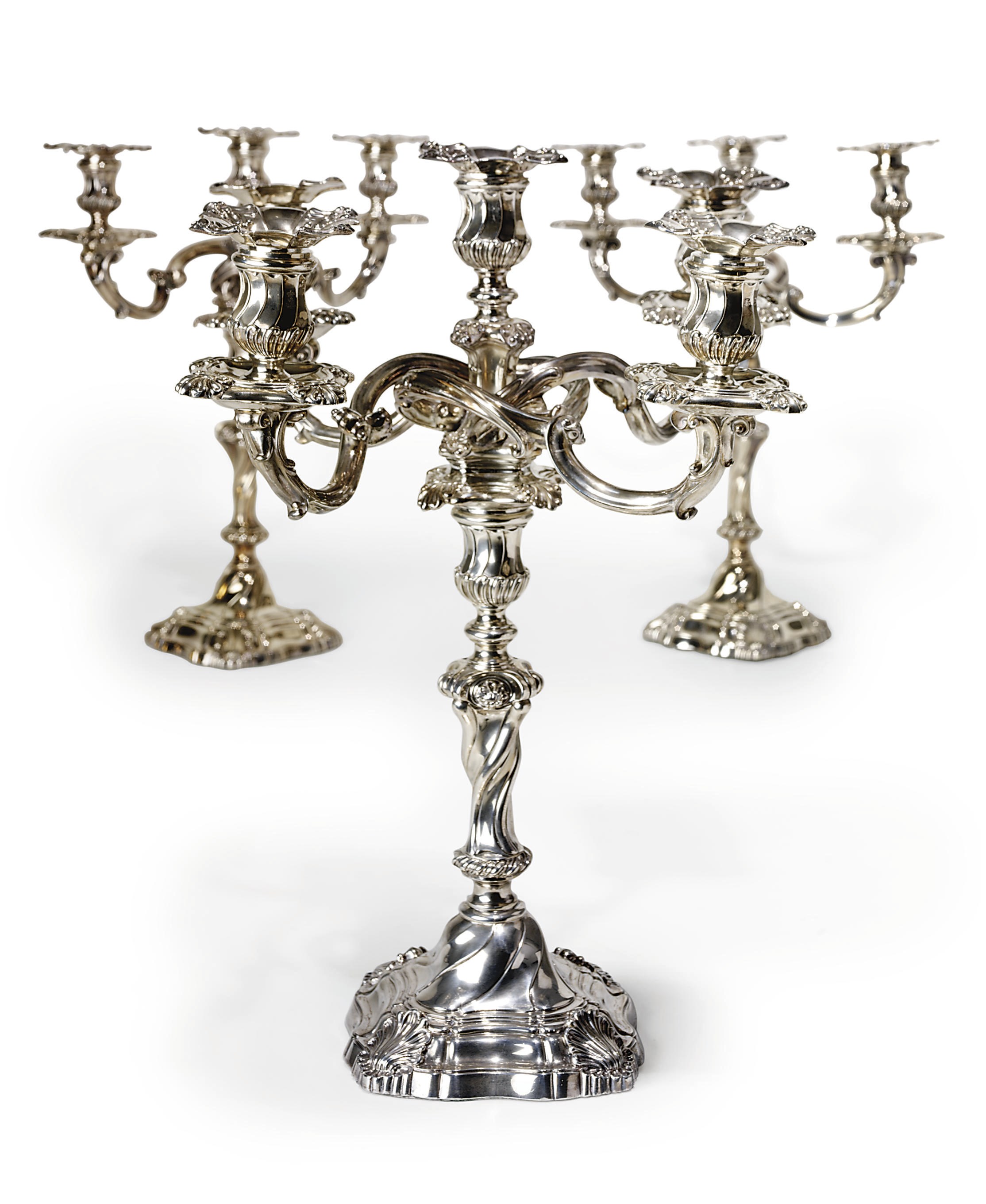 A GEORGE IV SILVER SUITE OF THREE CANDELABRA