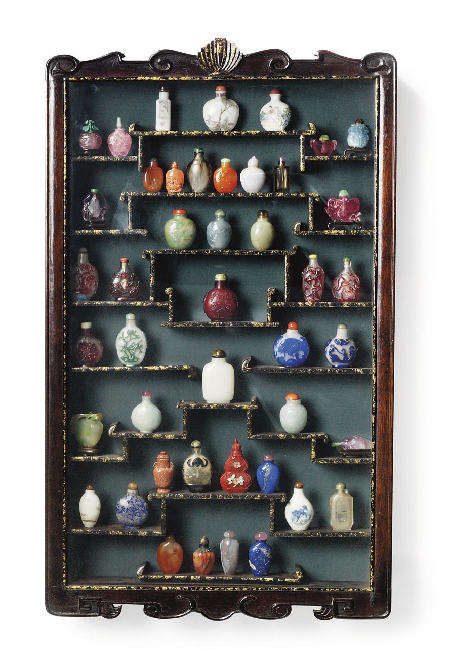 A MAHOGANY AND GILT-EBONISED GLAZED WALL CABINET