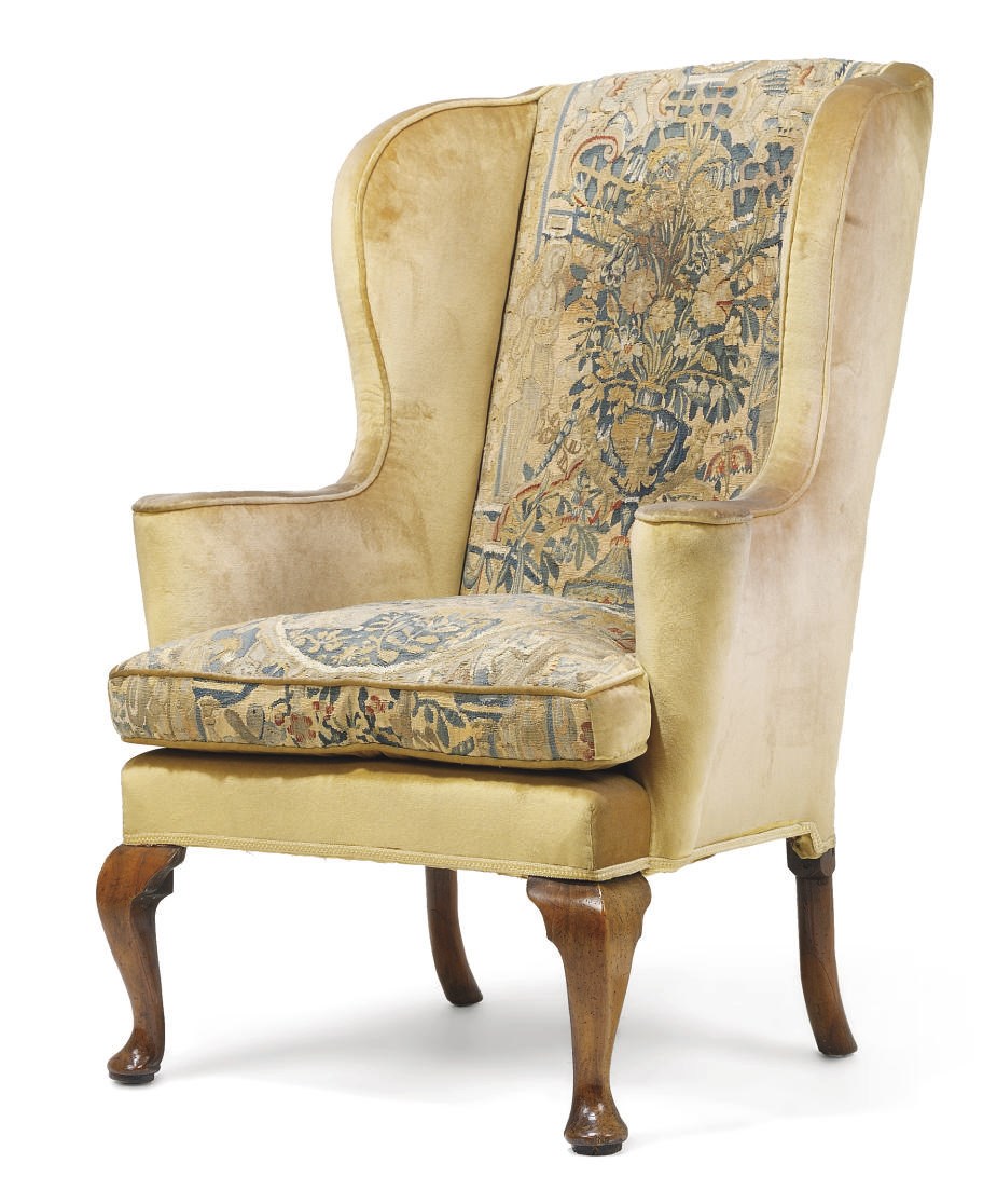 A GEORGE I WALNUT WING ARMCHAIR