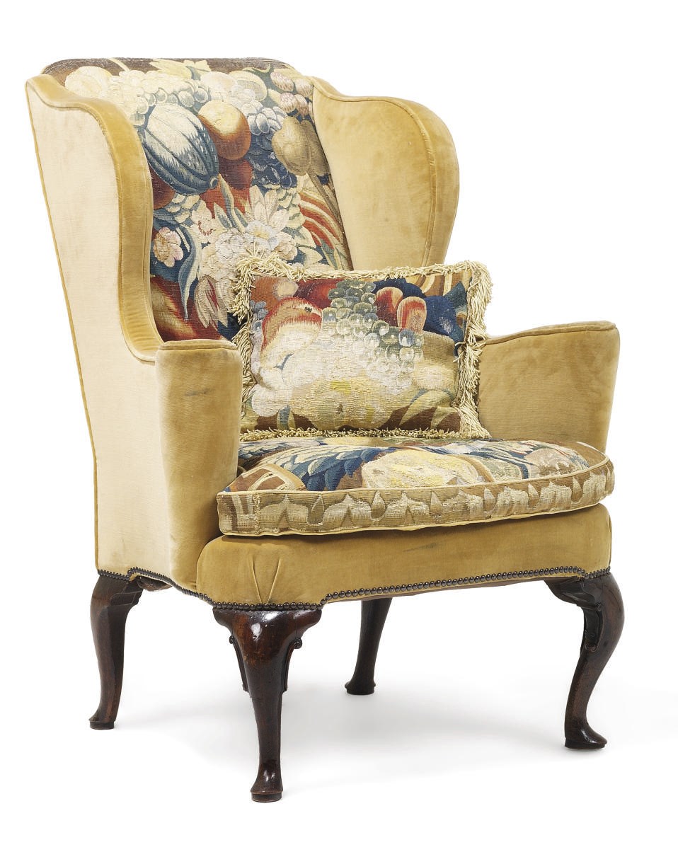 A GEORGE I WALNUT WING ARMCHAIR