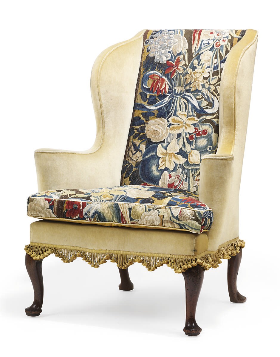 A GEORGE I WALNUT WING ARMCHAIR