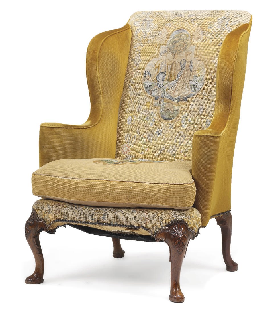 A GEORGE I WALNUT WING ARMCHAIR