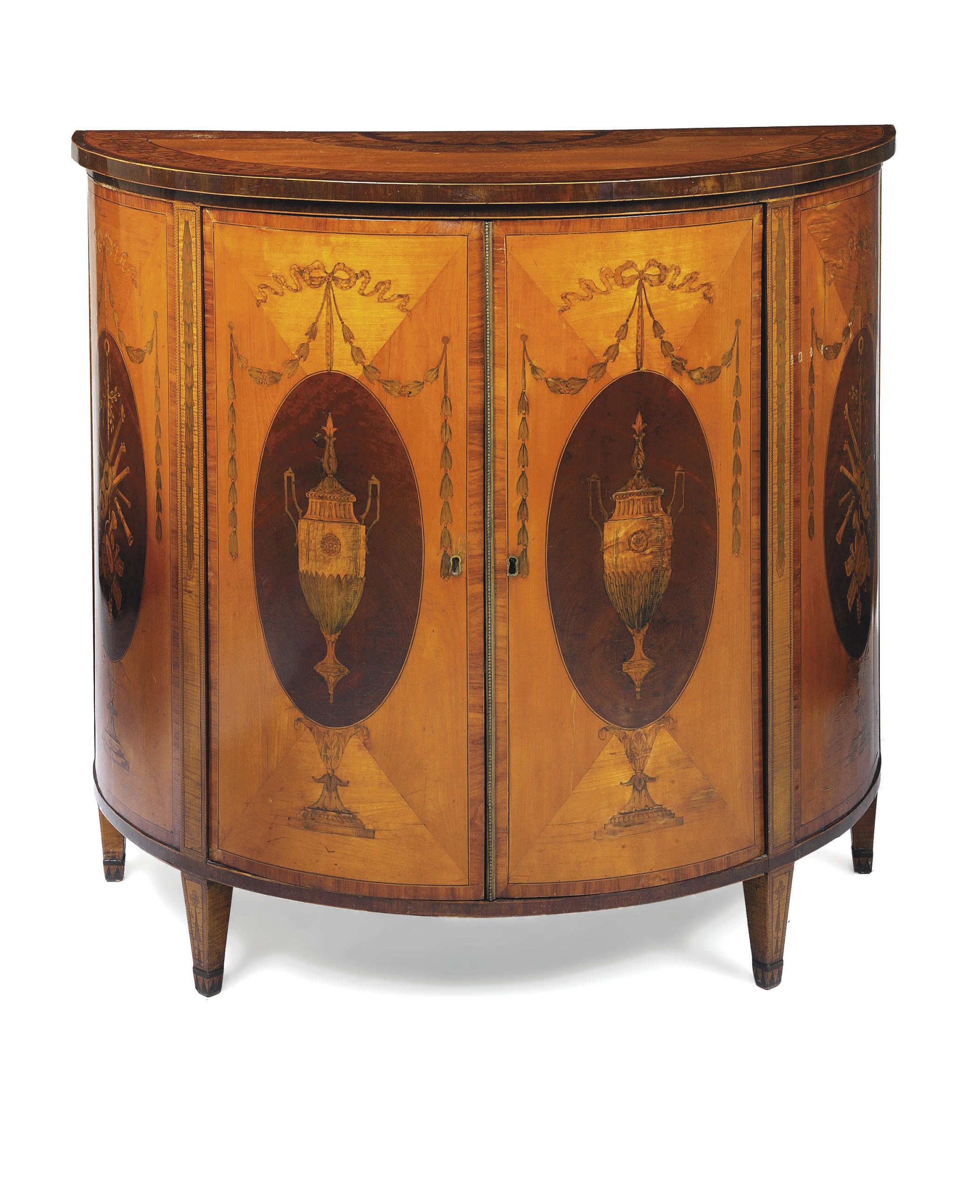 A GEORGE III SATINWOOD, MAHOGANY AND AMARANTH MARQUETRY DEMI-LUNE COMMODE