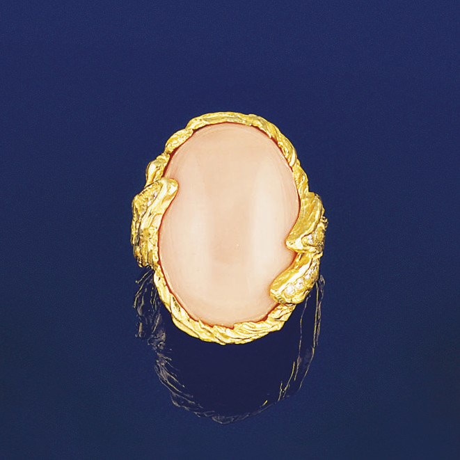 A coral and diamond ring, by Wolfers