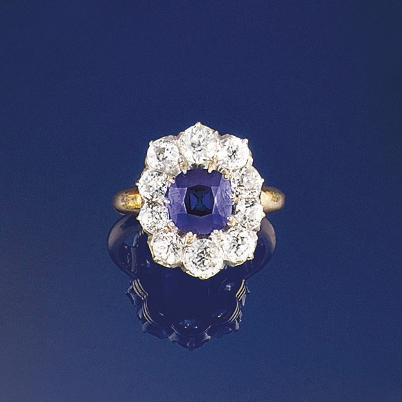 A late 19th/early 20th century sapphire and diamond cluster ring