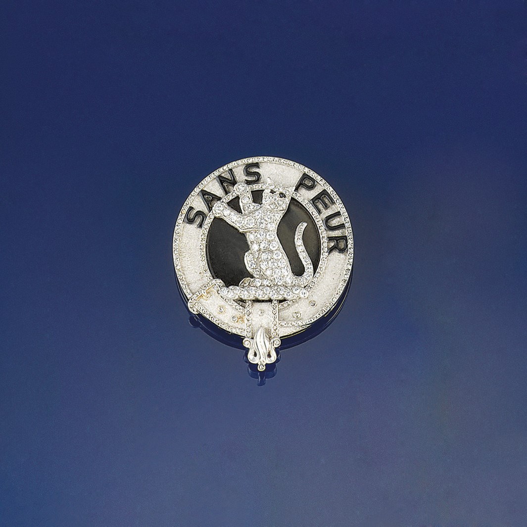 A platinum, diamond, onyx and enamel plaid brooch