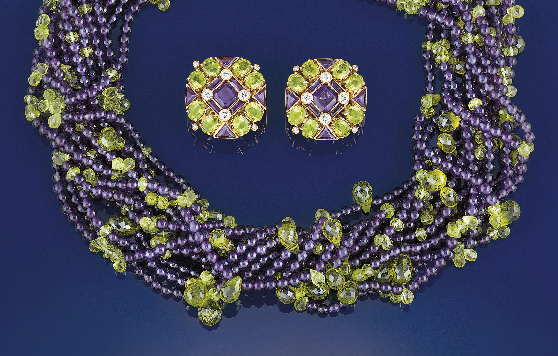 An amethyst and peridot torsade necklace and earclips