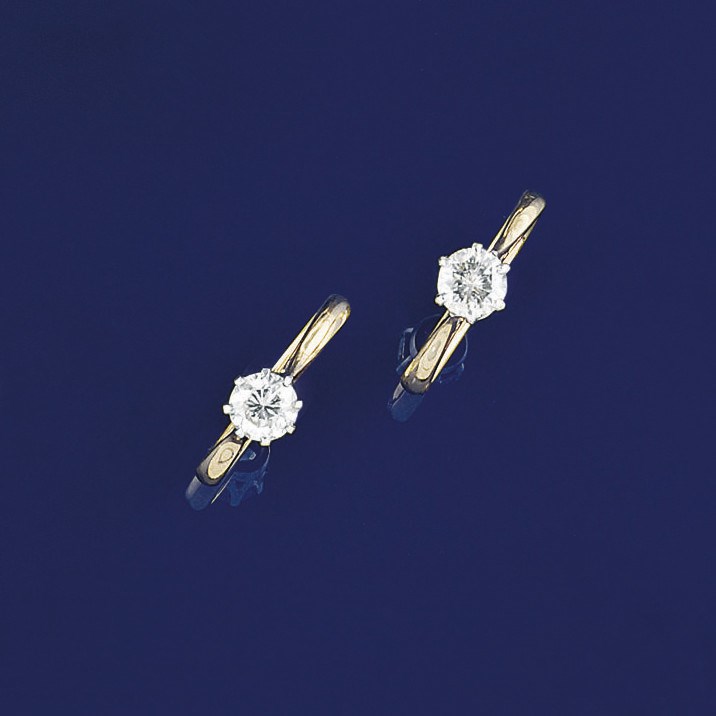 Two diamond single stone rings