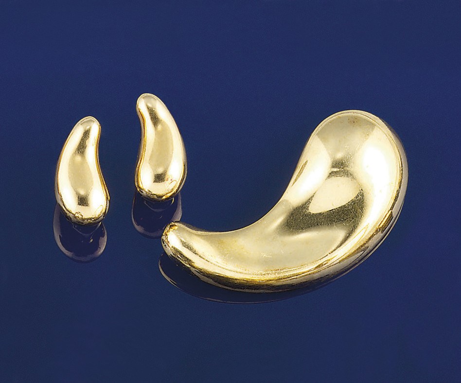 A pair of earclips and a brooch, by Elsa Peretti for Tiffany & Co.
