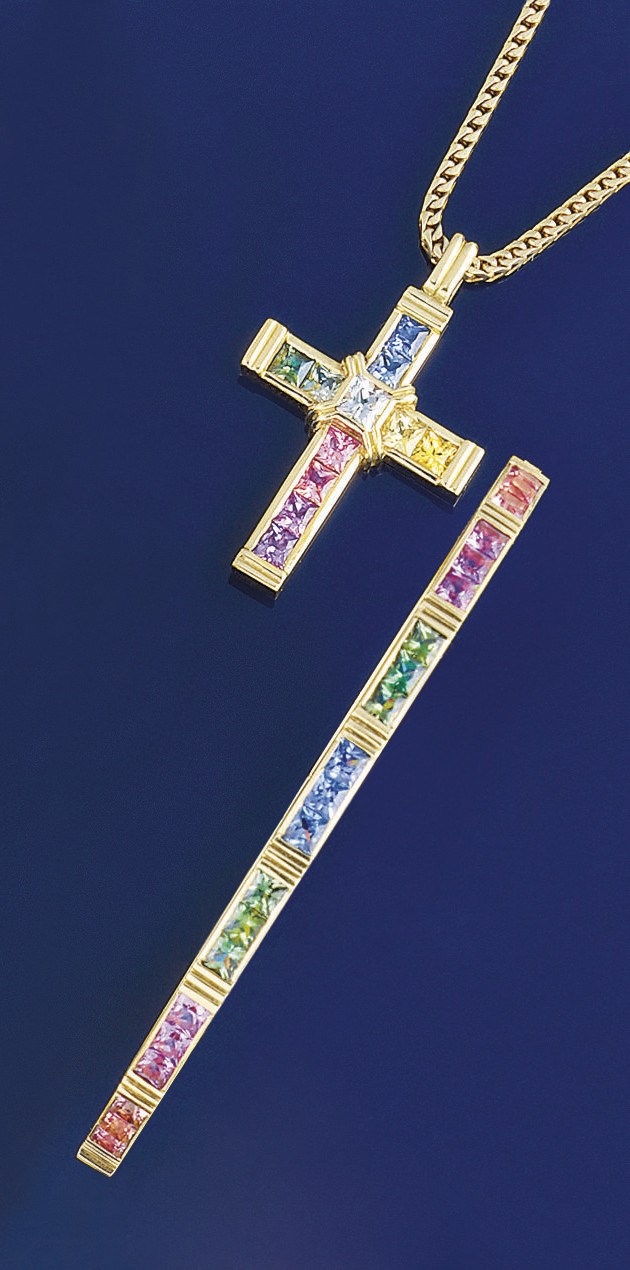 A vari-coloured sapphire bangle and cross pendant