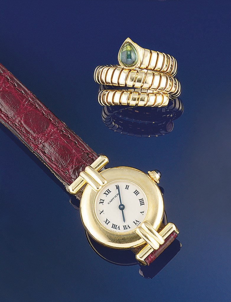 A lady's quartz wristwatch, by Cartier and an 18ct. gold and green tourmaline "Tubogas" ring, by Bulgari