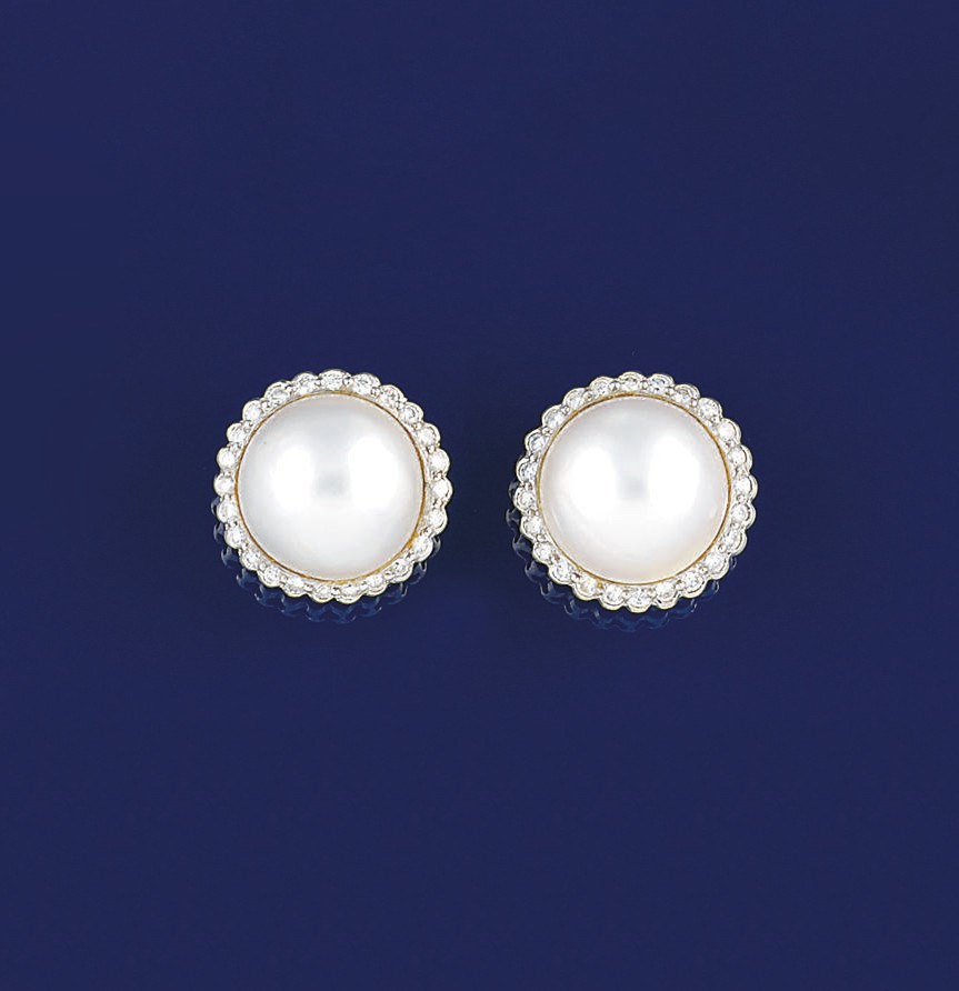 A PAIR OF MABÉ CULTURED PEARL AND DIAMOND EARCLIPS