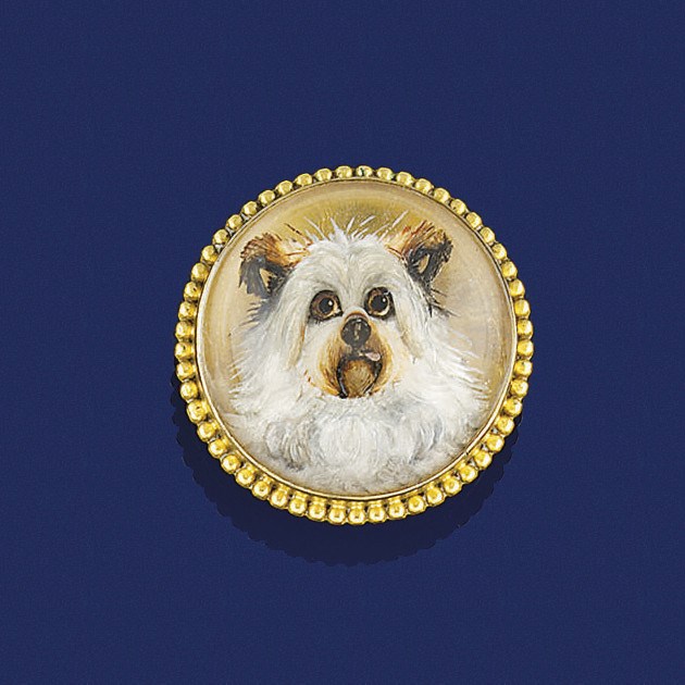 An early 20th century gold-mounted reverse painted crystal intaglio brooch