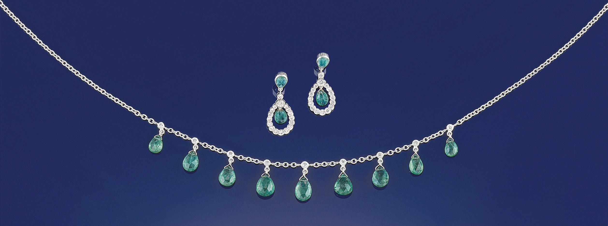 An emerald and diamond necklace and earpendants
