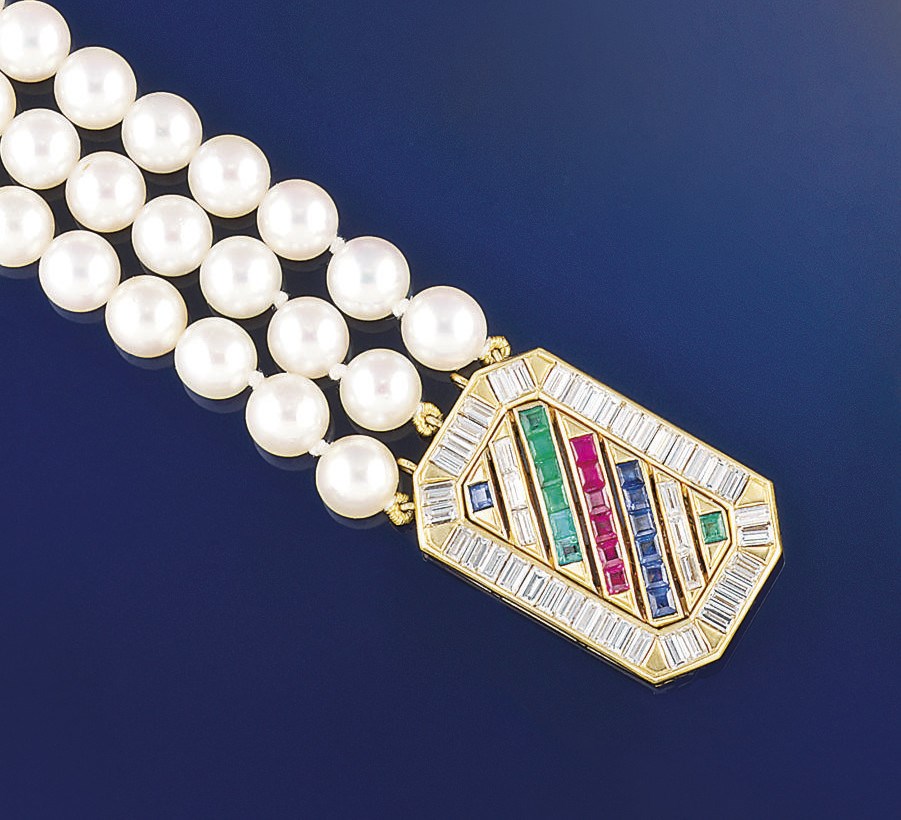 A cultured pearl necklace with gem-set clasp