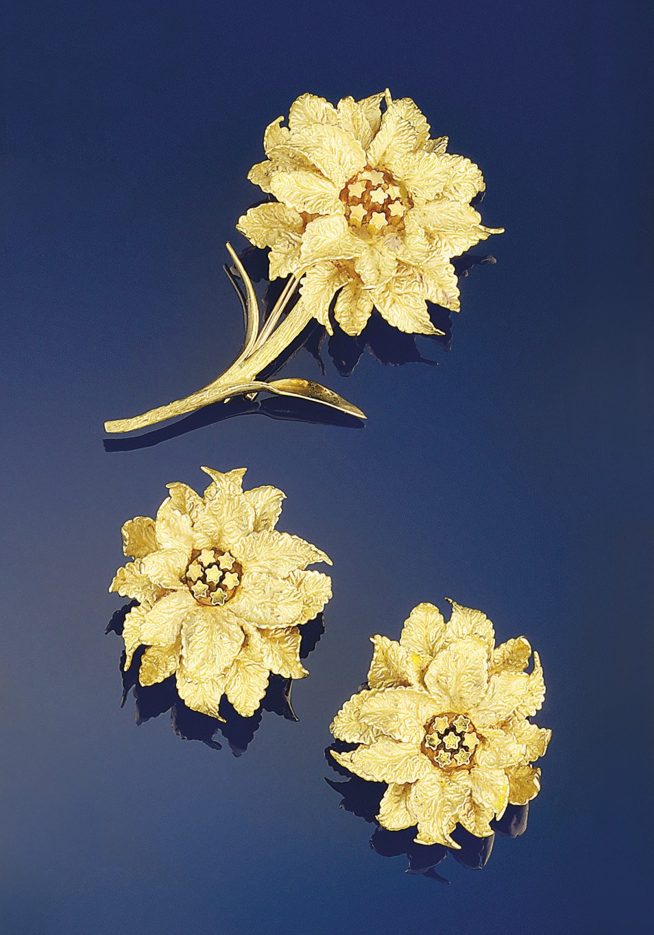 A pair of earclips and a brooch, by Hermes