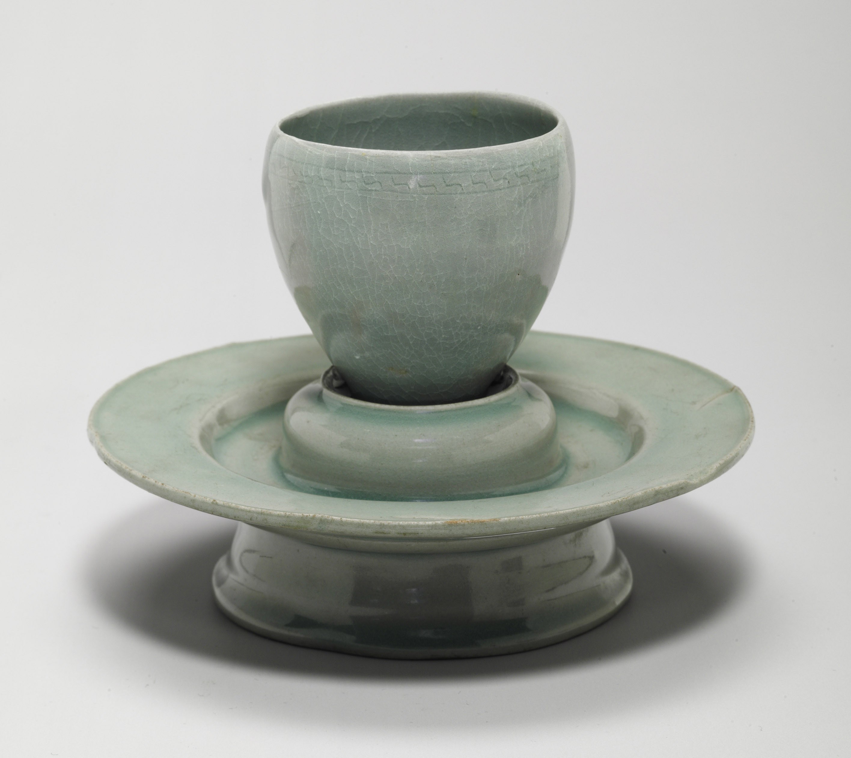 A Celadon Stoneware Cup and a Stand