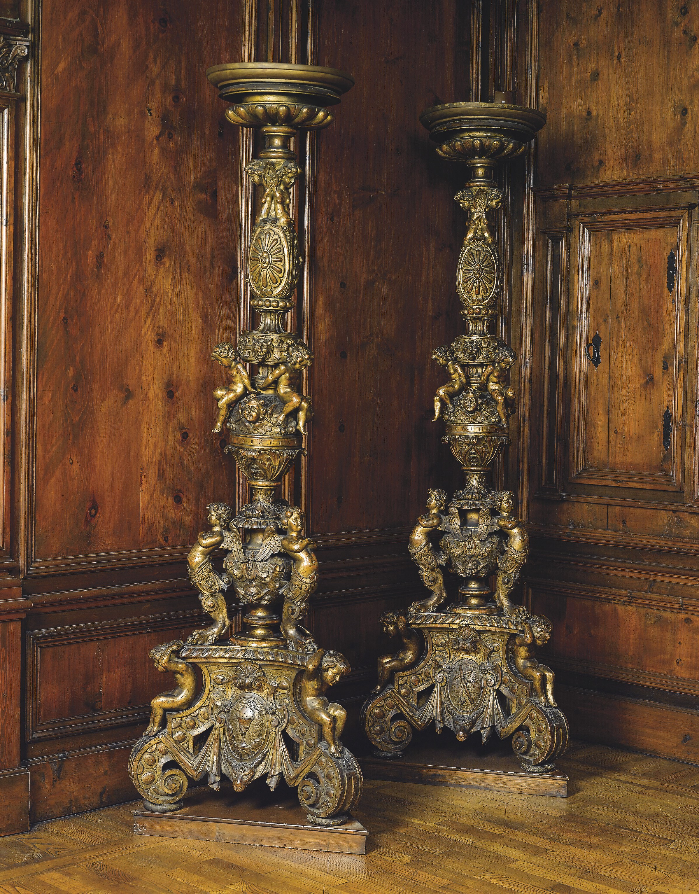 A PAIR OF ITALIAN CARVED GILTWOOD TORCHERES