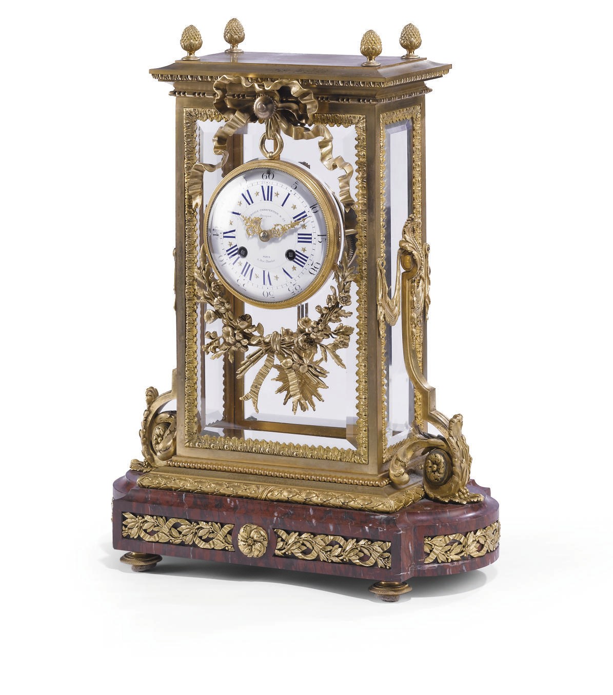 A FRENCH ORMOLU AND GRIOTTE ROUGE MARBLE MANTEL CLOCK
