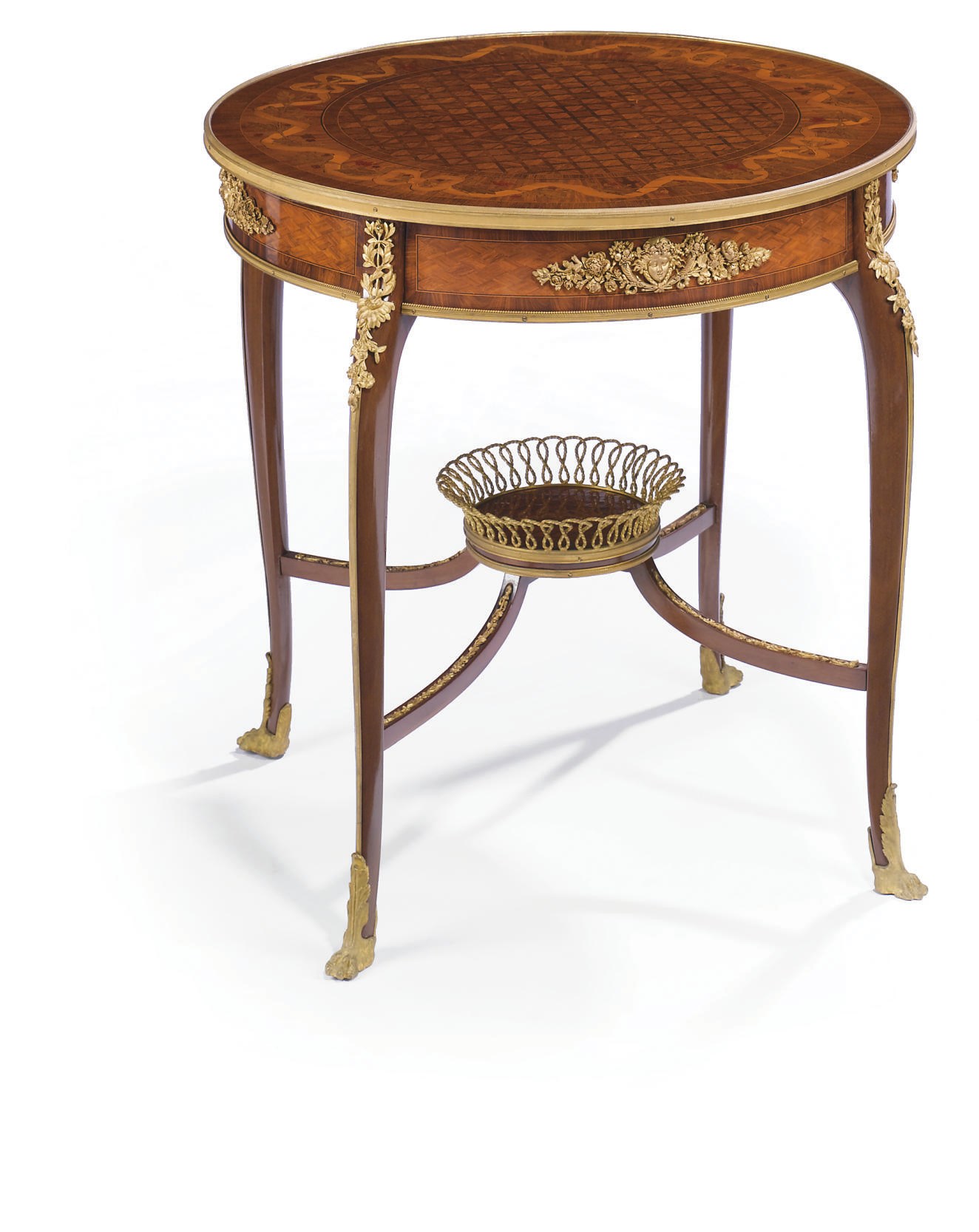A FRENCH ORMOLU-MOUNTED TULIPWOOD, MAHOGANY, MARQUETRY AND PARQUETRY GUERIDON