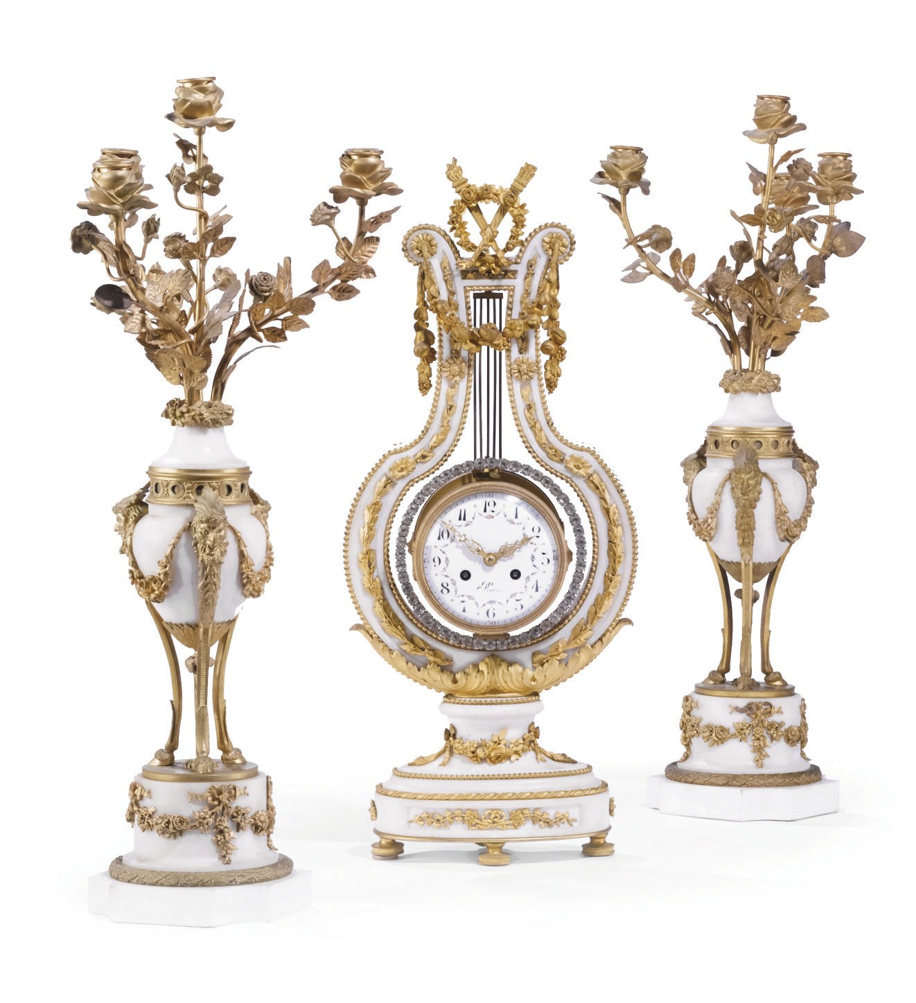 A MATCHED FRENCH ORMOLU, CARRARA MARBLE AND PASTE THREE-PIECE GARNITURE DE CHEMINEE