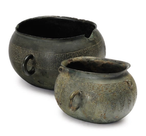 TWO CHINESE BRONZE RITUAL ELLIPTICAL VESSELS WITH RING HANDLES,