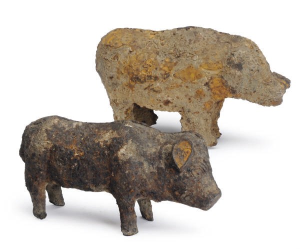 TWO CHINESE IRON FIGURES OF PIGS,