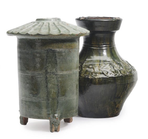 A CHINESE GREEN- GLAZED POTTERY MODEL OF A GRANARY ON BEAR- FORM FEET AND A JAR, HU,