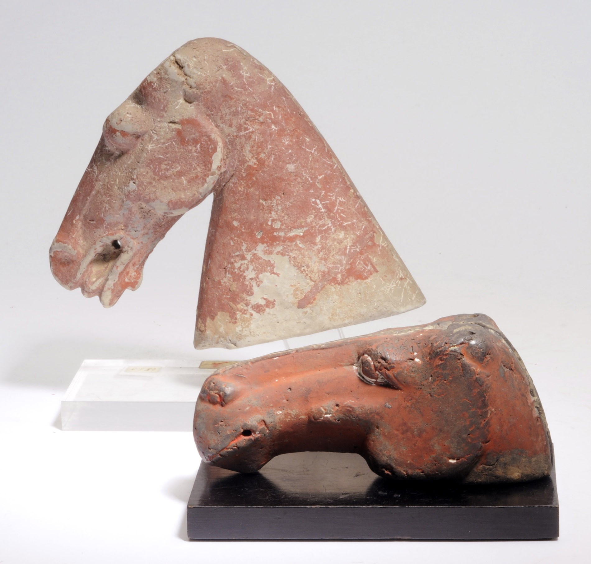 TWO CHINESE PAINTED POTTERY HORSE HEADS,