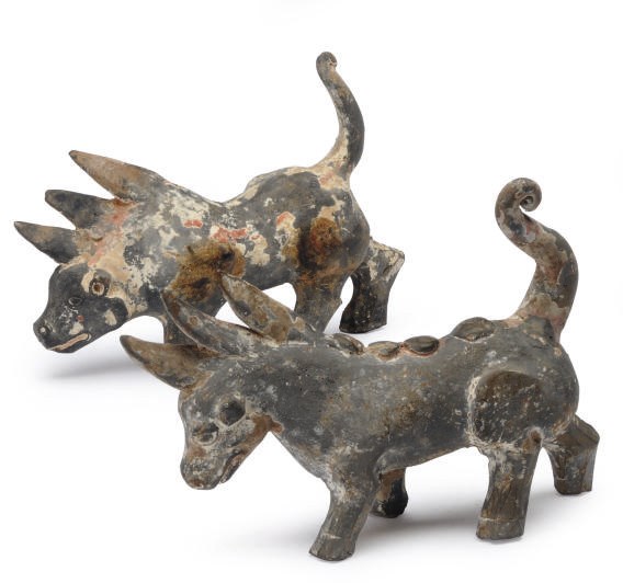 TWO CHINESE PAINTED GREY POTTERY FIGURES OF TRICORNS,