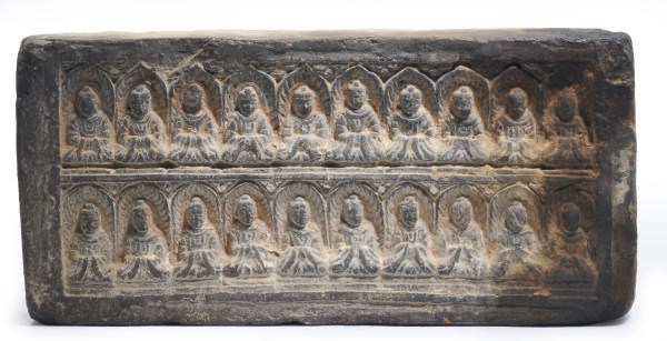 A CHINESE GREY POTTERY RECTANGULAR TILE MOLDED WITH A DOUBLE ROW OF SEATED BUDDHAS,