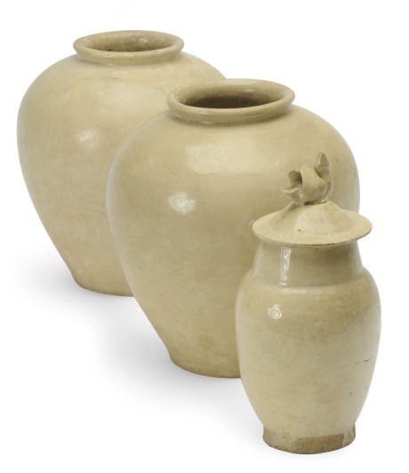 A PAIR OF CHINESE CREAM-GLAZED POTTERY OVOID JARS,