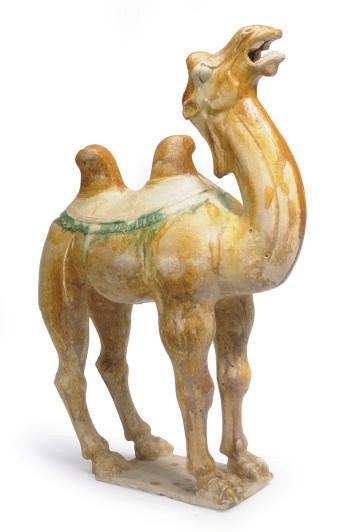 A CHINESE SANCAI-GLAZED POTTERY FIGURE OF A BACTRIAN CAMEL,