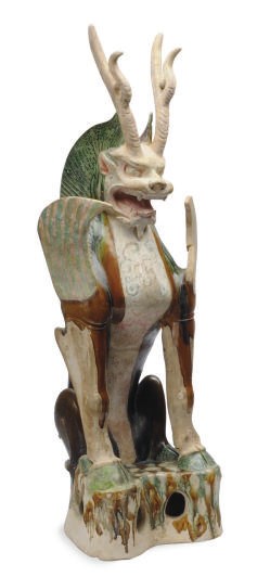 A CHINESE SANCAI-GLAZED POTTERY FIGURE OF AN EARTH SPIRIT,